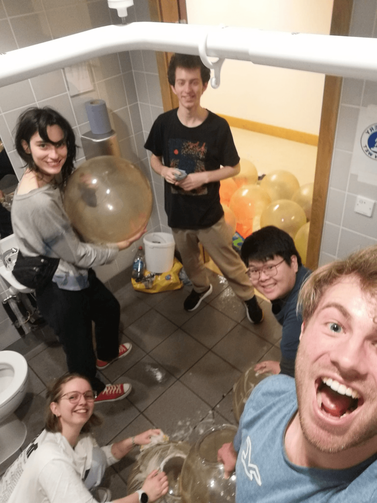 Assisting the team to clean protective lamp bulbs in preparation for upcoming events.